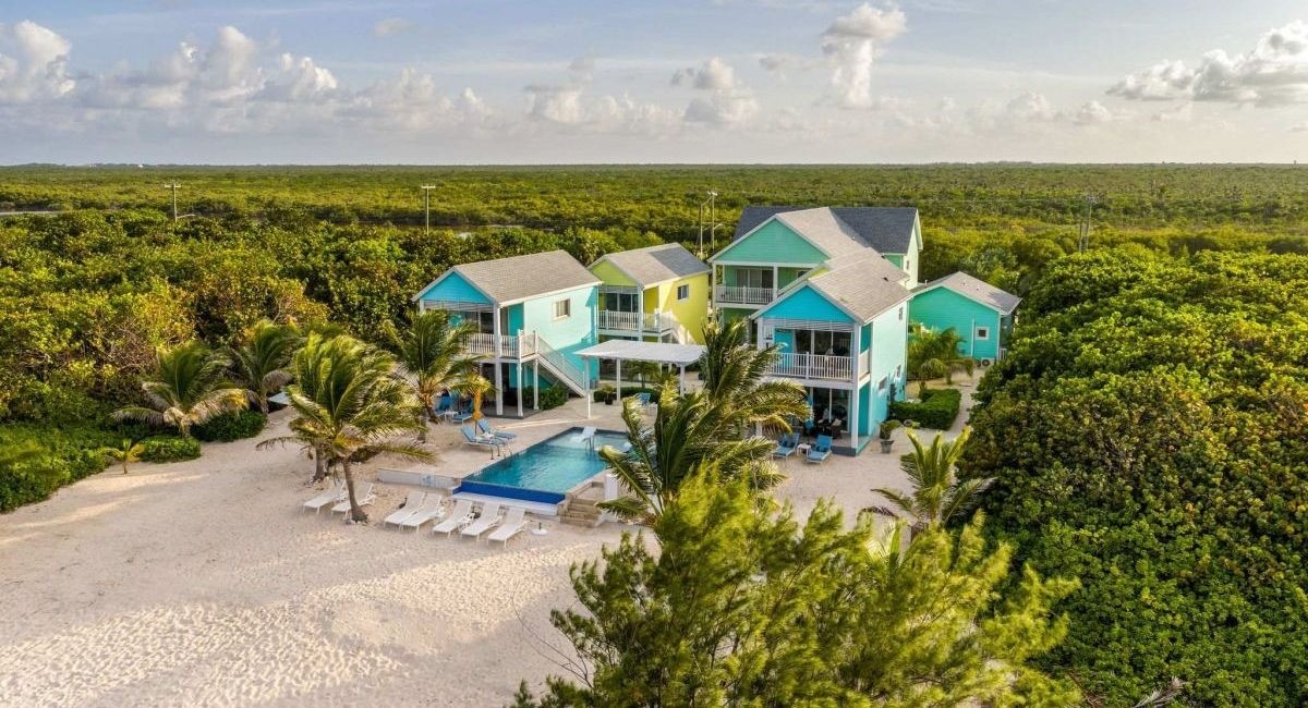 A multi-bedroom cottage in grand cayman, great to host group travellers. The property is surrounded by lush tropical forests and overlooks a sandy beach